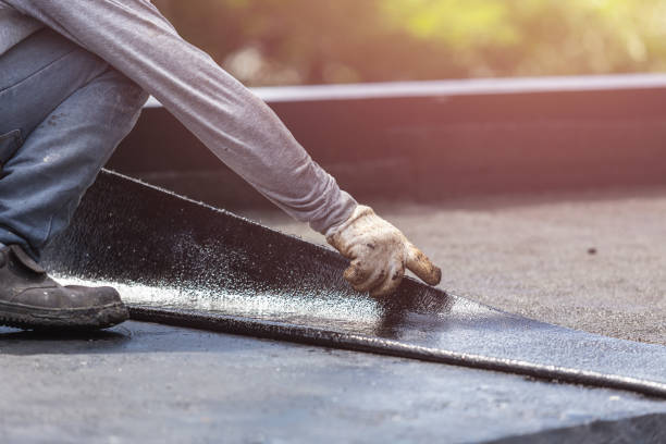 Professional Exterior Waterproofing technician working in Flint, MI